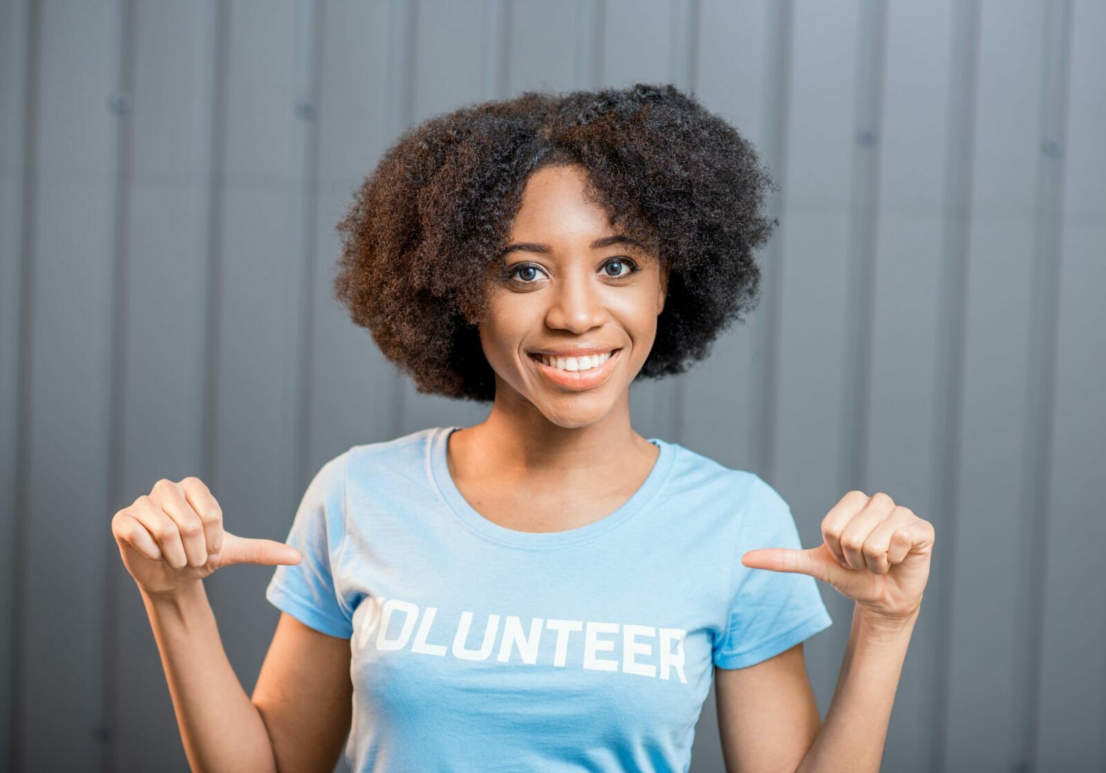 Woman volunteering in a blue t-shirt